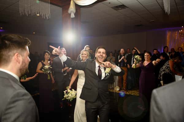 The groom dancing.