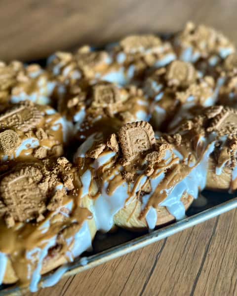 Soft, fluffy rolls drizzled with warm cookie butter, sweet glaze, and crunchy cookie crumbles. Gooey, buttery, and perfect with coffee