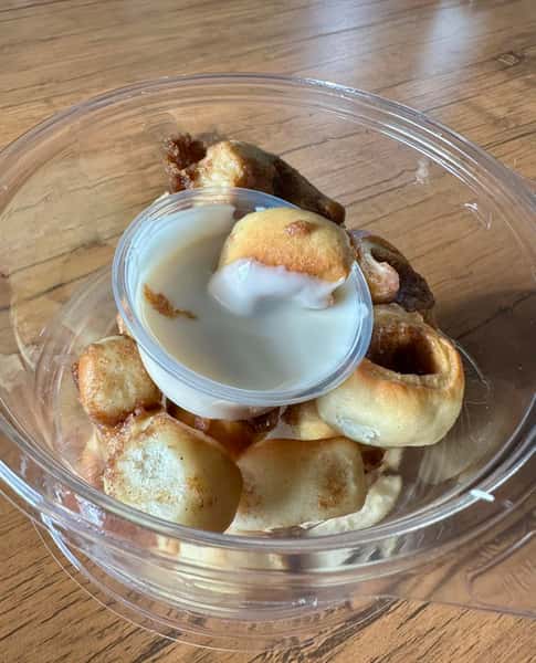 Mini Cinnamon Roll Bites served with our creamy vanilla glaze