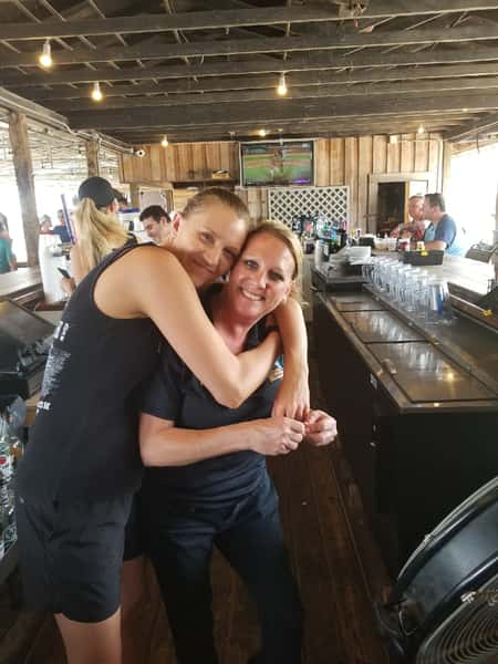 bartenders hugging