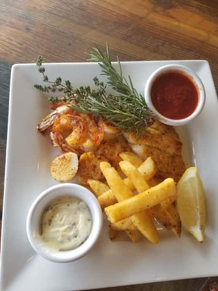 shrimp, fish fillet, and french fries with cocktail sauce, and tartar sauce
