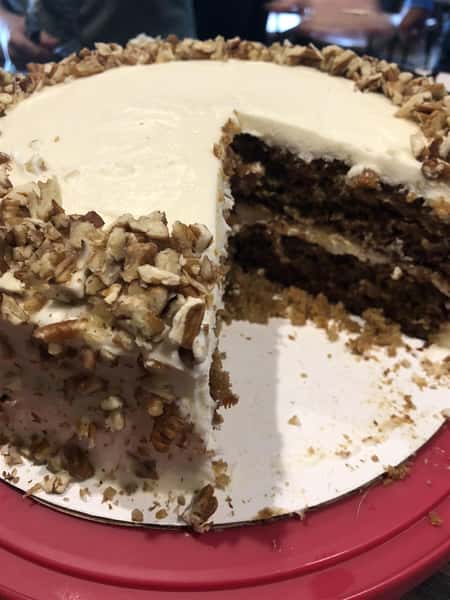 chocolate cake with vanilla frosting and almonds