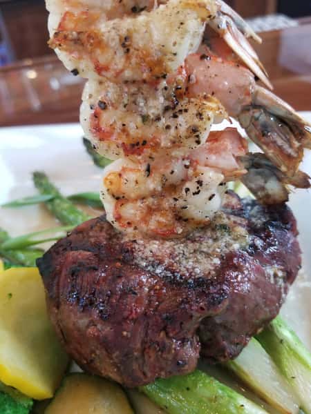 Surf and Turf- piece of steak with shrimp skewer, asparagus on side