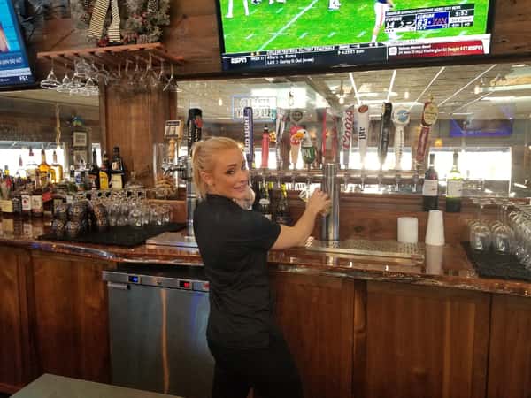bartender serving beer on tap
