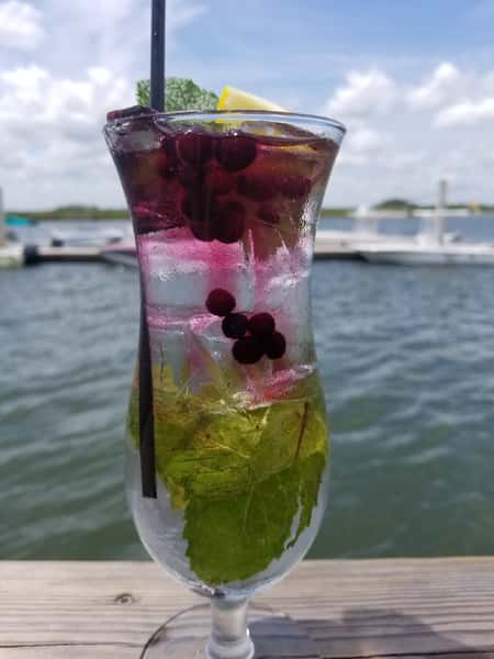 cocktail wiht mint leaves and berries