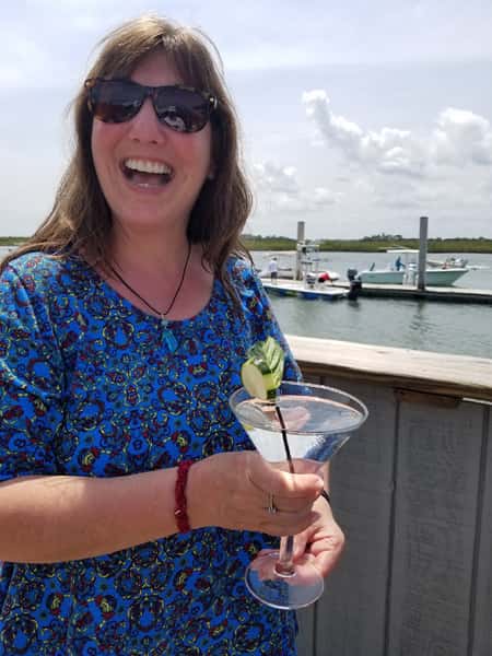 woman drinking a cucumber lime amrtini