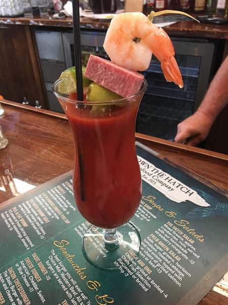 bloody mary with shrimp, salami, lime, peppers