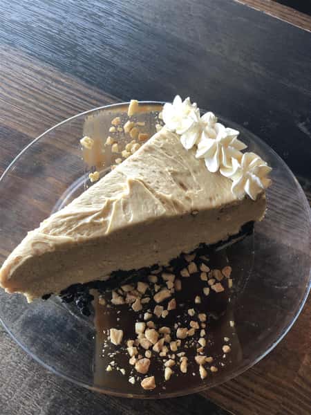 piece of pie with caramel and chopped peanuts