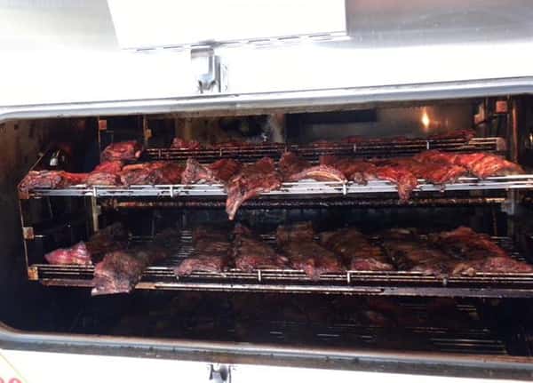racks of meat in a smoker