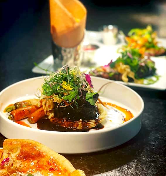 Multiple Plates with Amazing Food