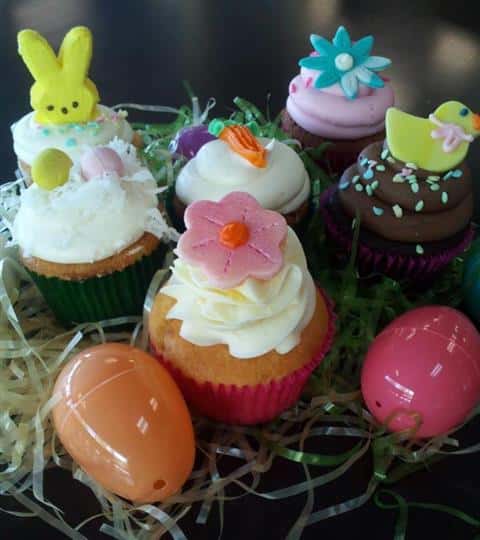 Several cupcakes with colorful Easter decoration