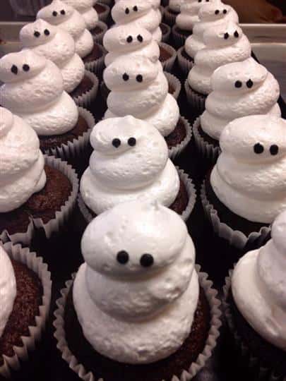 Chocolate cupcakes topped white frosting