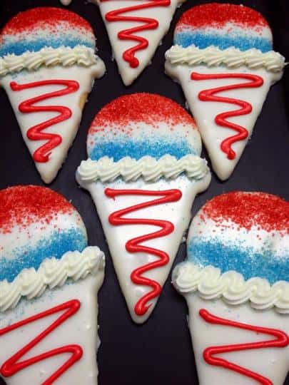 Covered cookies in ice cream cone shape with red and blue decoration