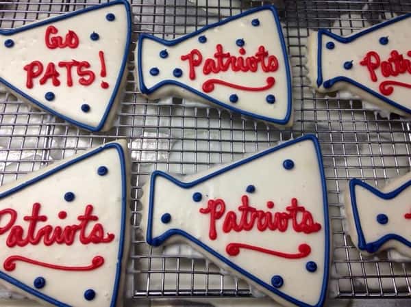Covered white cookies topped with red and blue decoration