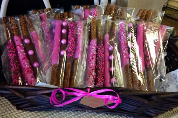 Packets of four chocolate sticks with pink toppings