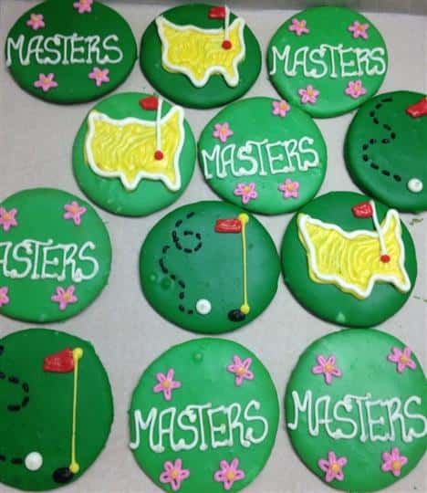Green covered cookies topped with colorful decoration