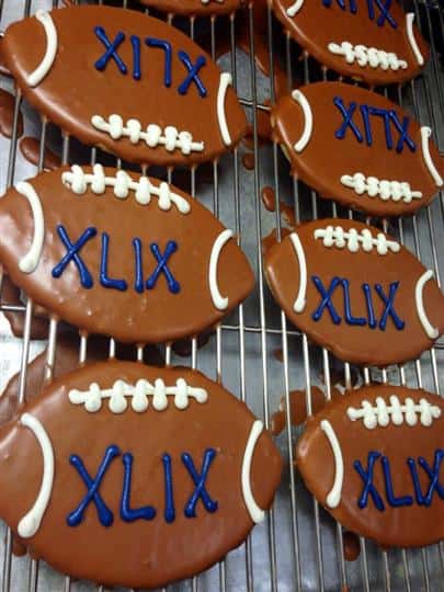 Chocolate cookies in football shape topped with milk chocolate