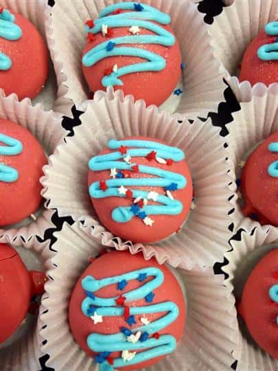 Red fudge topped with light blue decoration and white, blue and red stars