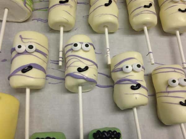 White cake pops with decoration of a funny face