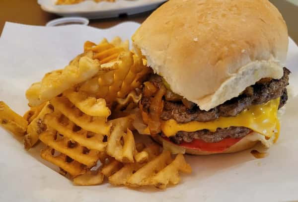 Loaded burger with cheese and fries