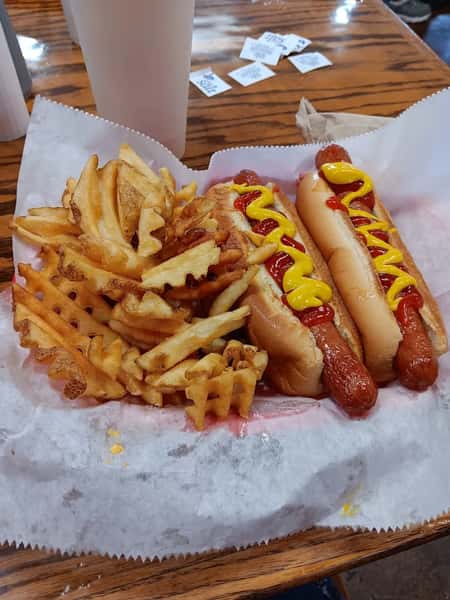 Hotdogs with mustard sauce and fries