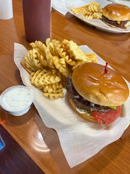 Loaded burger with cheese and fries