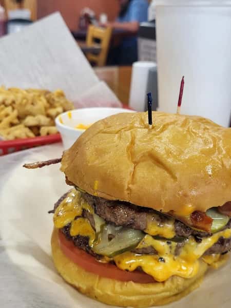 Loaded burger with cheese and fries