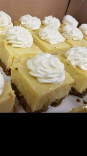 cheesecake bites topped with whipped cream