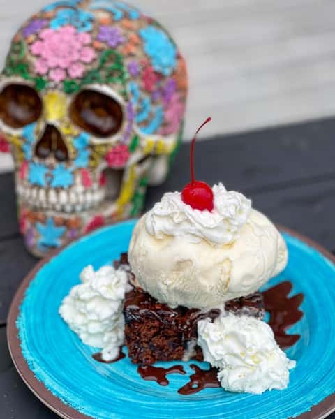 Triple Chocolate Chop brownie served with vanilla ice cream