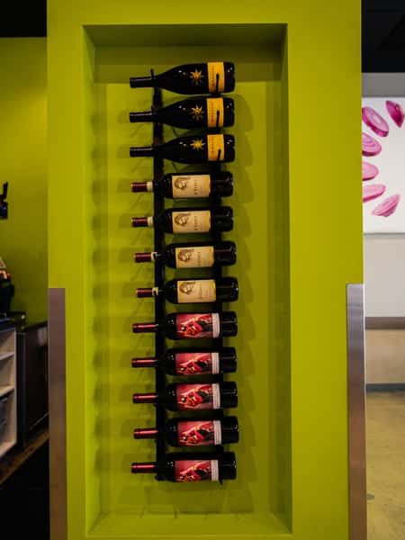 Wine rack on a green wall