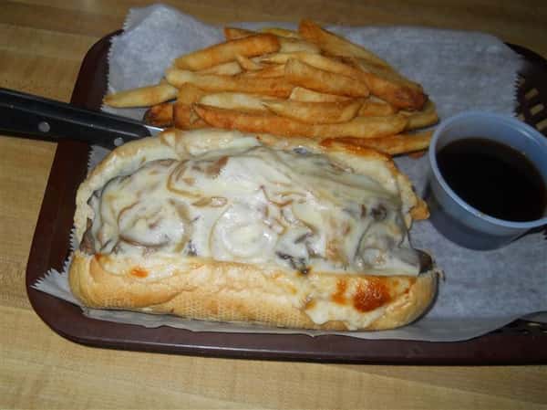 cheesesteak with fries and dipping sauce