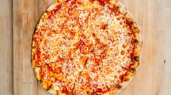 Cheese pizza with red sauce and melted mozzarella on a wooden surface.