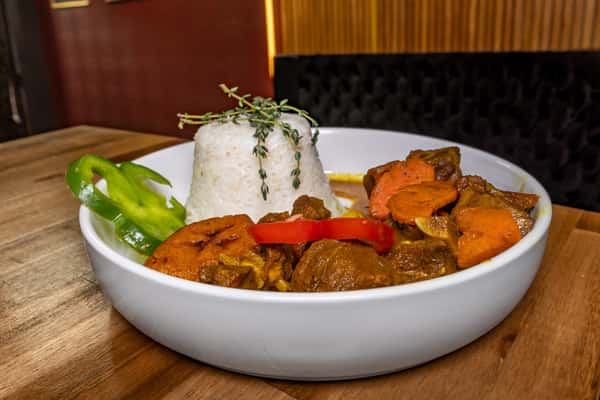 Curry Goat with 2 Sides