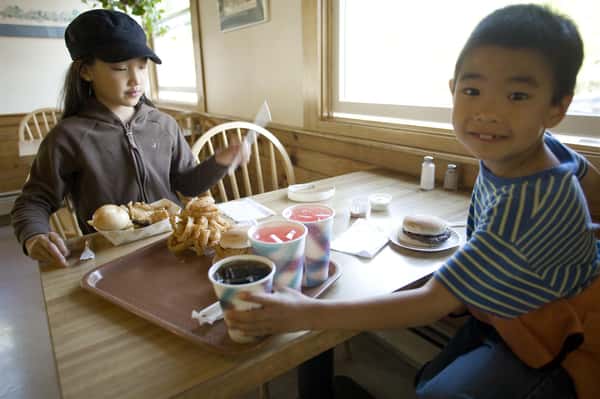 two children sitting at a table