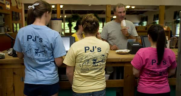 three woman standing with PJ's t shirts