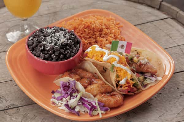 Tres Taco Especial! Our isalnd shrimp taco, tinga taco and tecate fish taco served with rice and black beans.