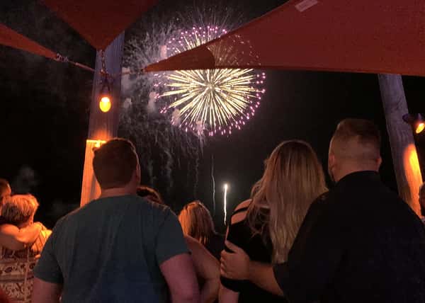 crowd of people watching fireworks show
