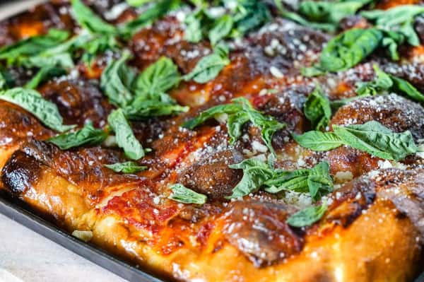 Pizza with pepperoni and basil