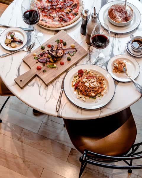 Top view of a table full of food and drinks
