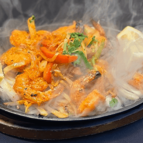 Steamy curry on a frying pan