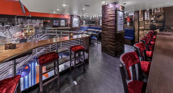 long table with velvet red seating