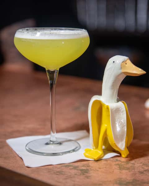 cocktail and goose figurine