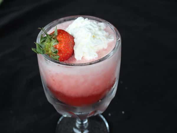 strawberry daiquiri topped with whipped cream