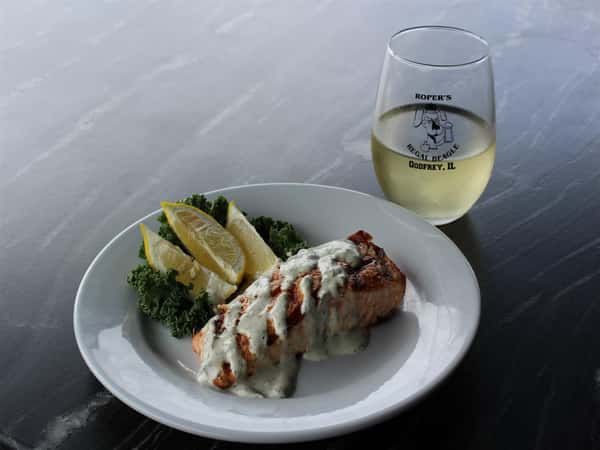 salmon topped with dill sauce
