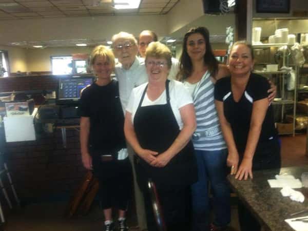 six staff members posing for a picture