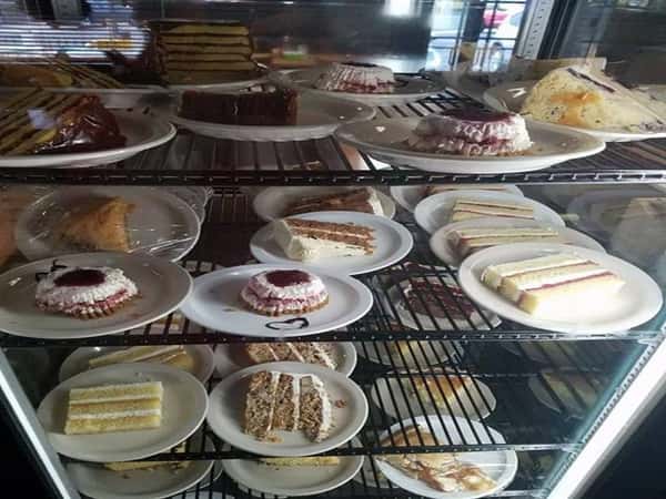 assortment of bakery goods in a glass case