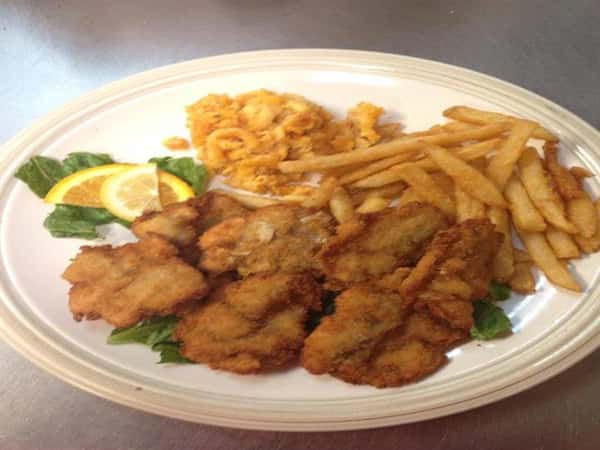 Fried chicken cutlets with a side of fries and mac and cheese