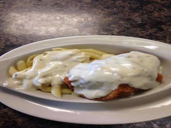 Penne pasta chicken topped with creamy alfredo sauce