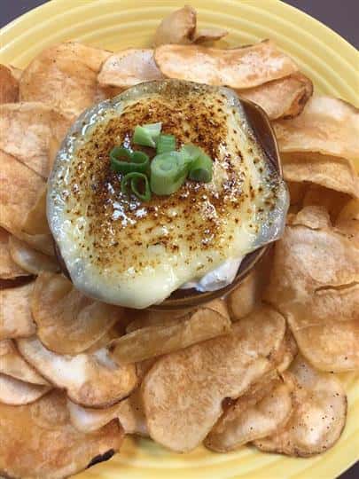 potato chips with a side of cheesy dipping sauce
