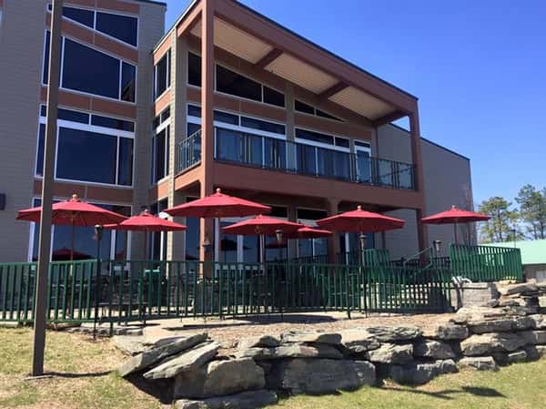 outdoor seating area with seven red umbrellas